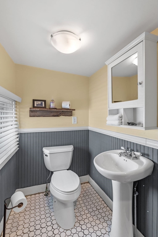 184 North Street Salem, MA 01970 - Photo 23 of 39 a bathroom with a toilet a sink and mirror