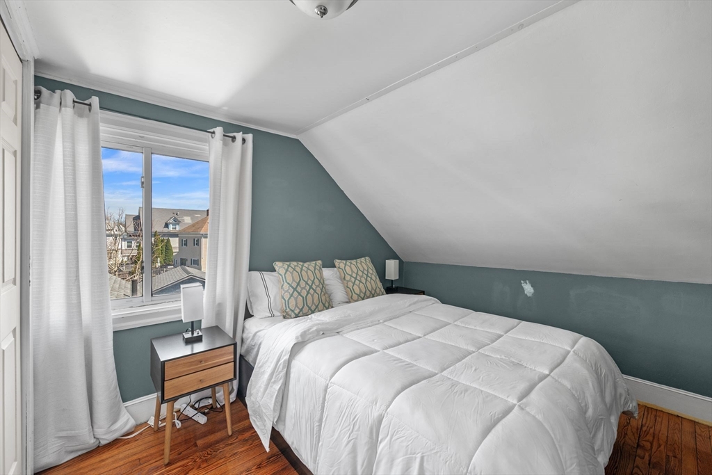 184 North Street Salem, MA 01970 - Photo 31 of 39 a bed sitting in a bedroom next to a window