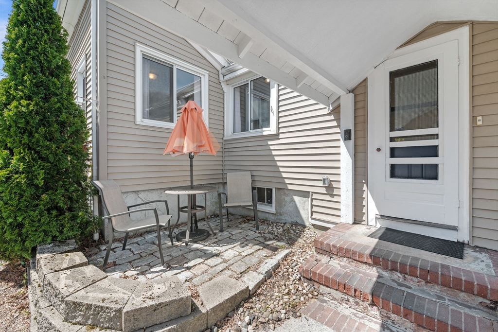 184 North Street Salem, MA 01970 - Photo 34 of 39 a view of a patio with a table and chairs and wooden floor