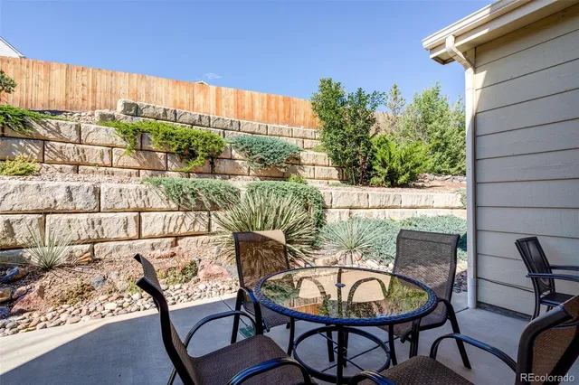 a view of a chairs and table in patio