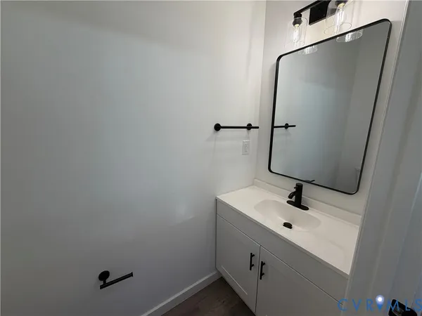 a bathroom with a sink and mirror