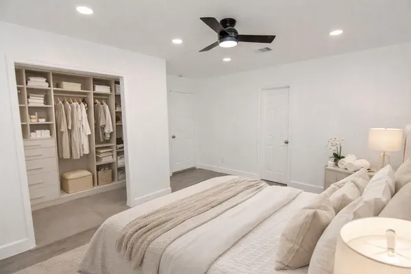 a large kitchen with a sink a refrigerator and a stove