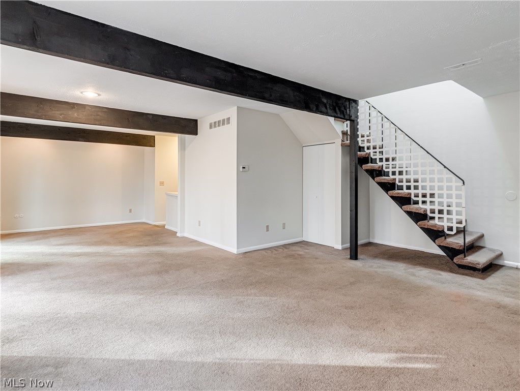 2550 Chamberlain Road, Unit A3 Akron, OH 44333 - Photo 8 of 21 Living room with light colored carpet