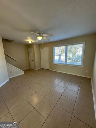 a view of an empty room with a window