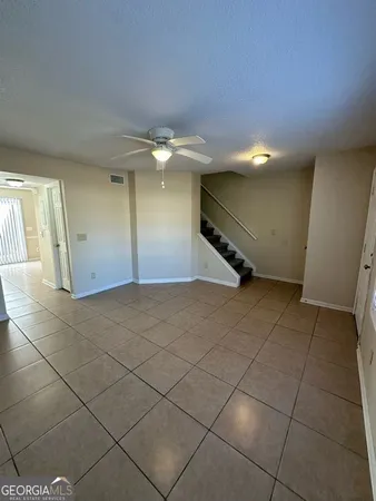 a view of a livingroom with an empty space and a sink