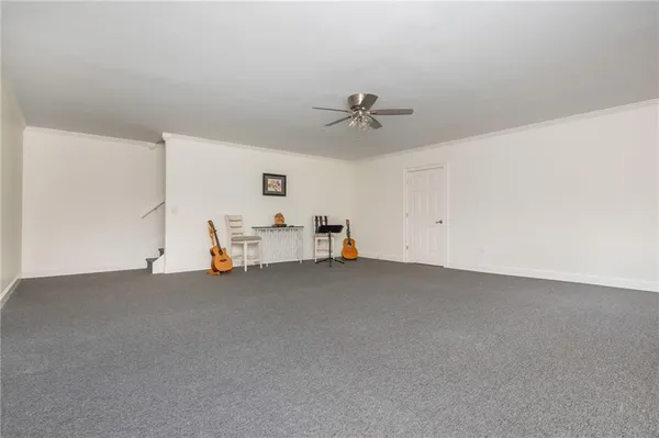 a living room with furniture and white walls