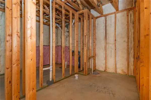 a view of a room with wooden walls