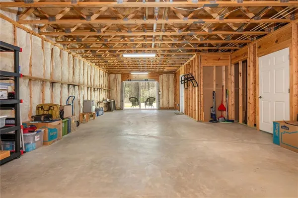 a view of an empty room with a garage