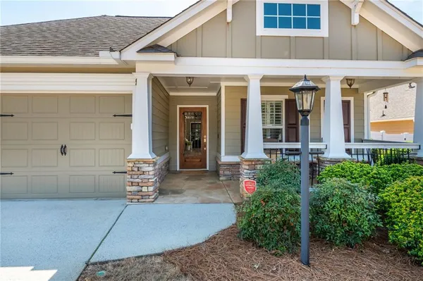a front view of a house with outdoor seating