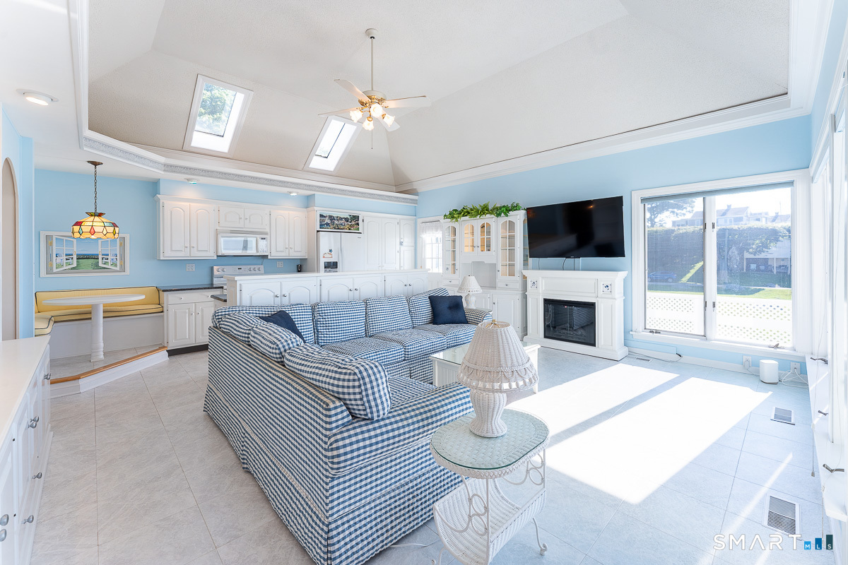 132 Latimer Point Road, Unit 132 Stonington, CT 06378 - Photo 11 of 38 Kitchen and open living room area showcasing water-views of Fisher's Island Sound.