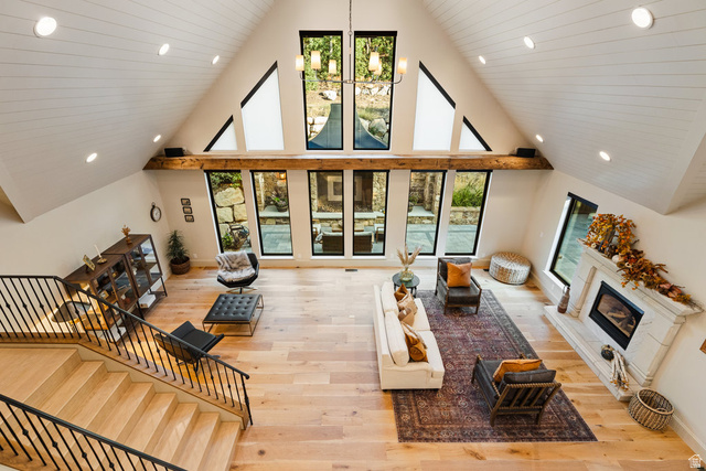 1141 South Oak Leaf Lane Springville, UT 84663 - Photo 40 of 147 Vaulted ceiling great room featuring light wood-finish flooring, a white paneled ceiling with recessed lighting, an exposed wood beam, and a fireplace with a decorative mantel