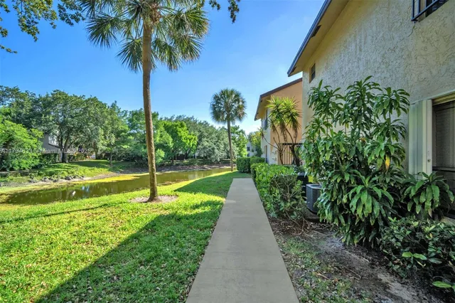a view of a garden with a small pool