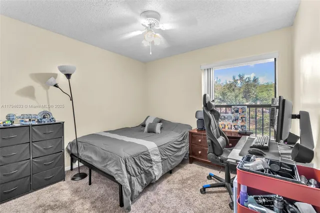 a bedroom with a bed a desk and chair