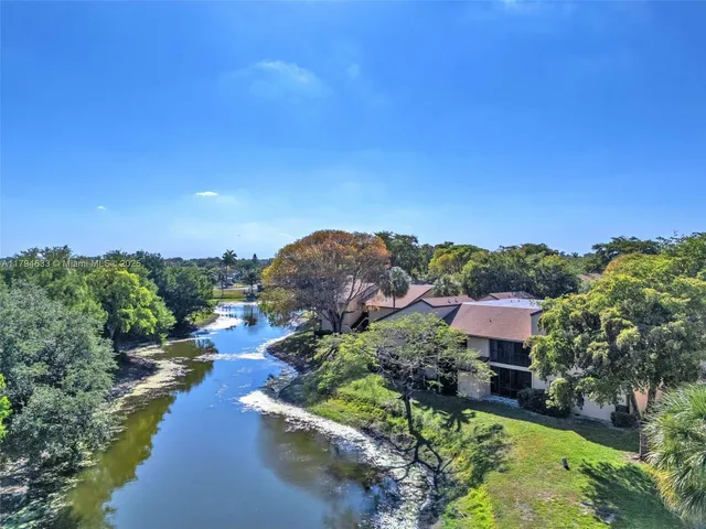an aerial view of a house with a garden