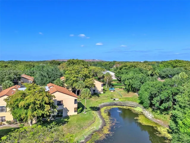 a aerial view of a house with big yard