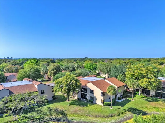 a aerial view of a house with big yard