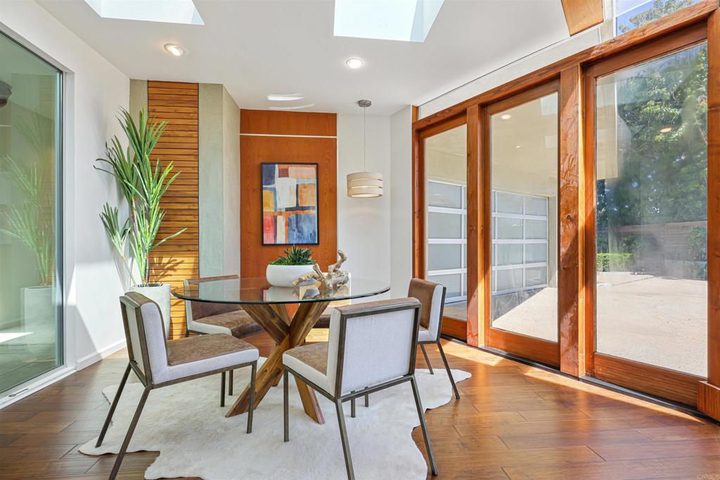 3312 James Drive Carlsbad, CA 92008 - Photo 11 of 41 a view of a dining room with furniture window and wooden floor