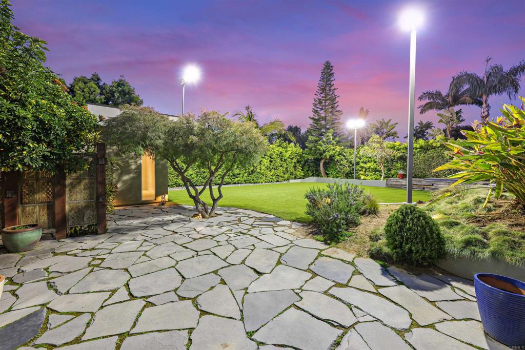 3312 James Drive Carlsbad, CA 92008 - Photo 12 of 41 a view of a garden with a building in the background