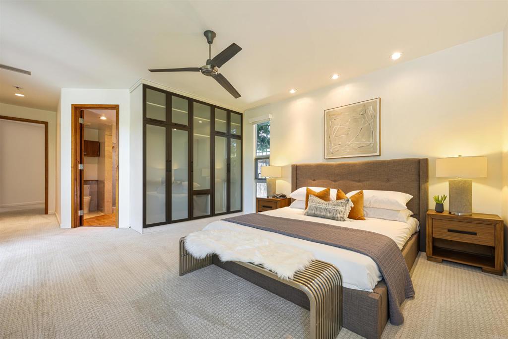 3312 James Drive Carlsbad, CA 92008 - Photo 15 of 41 a bedroom with a bed and a chandelier