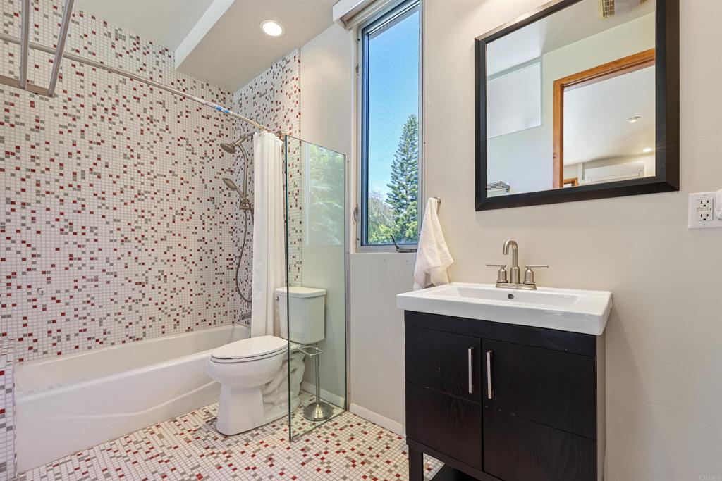 3312 James Drive Carlsbad, CA 92008 - Photo 19 of 41 a bathroom with a sink toilet and mirror