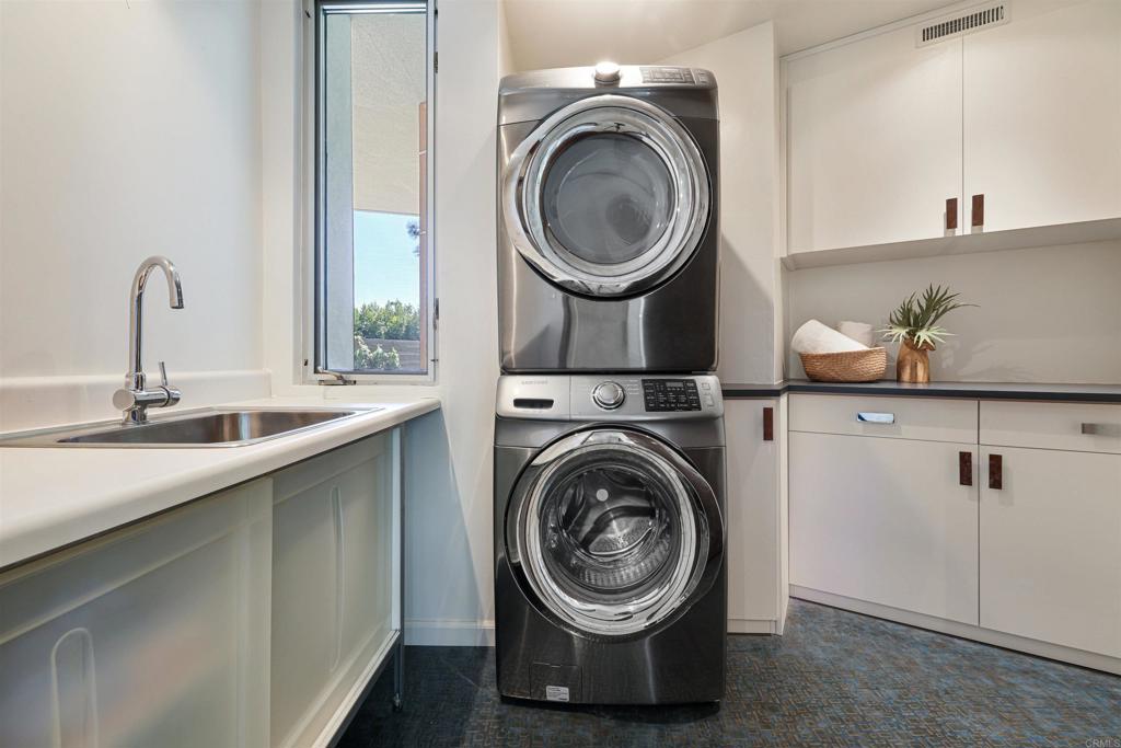 3312 James Drive Carlsbad, CA 92008 - Photo 22 of 41 a utility room with sink dryer and washer