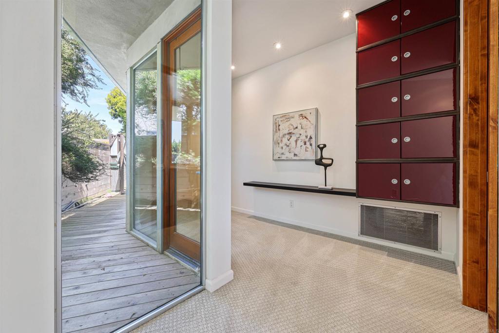 3312 James Drive Carlsbad, CA 92008 - Photo 23 of 41 a view of a hallway with wooden floor and cabinet