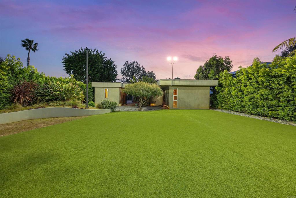 3312 James Drive Carlsbad, CA 92008 - Photo 35 of 41 a view of a house with a yard and a garage