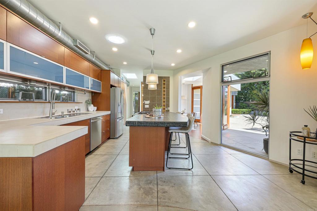 3312 James Drive Carlsbad, CA 92008 - Photo 5 of 41 a kitchen with a sink and chairs