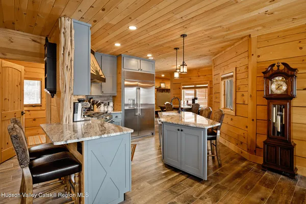 a living room with furniture a fireplace and a table