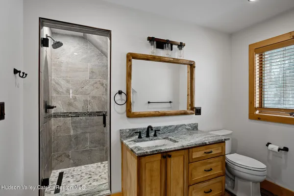 a view of a yard with wooden fence