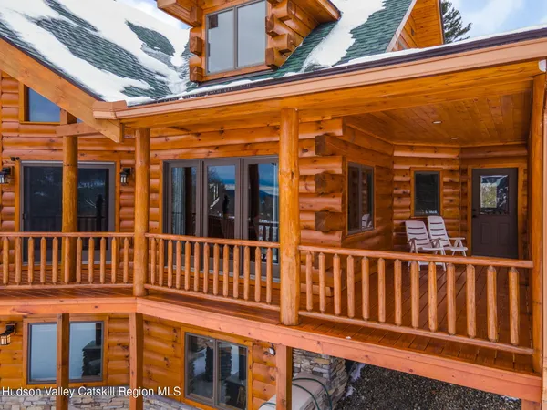 a kitchen with stainless steel appliances granite countertop a stove a sink dishwasher a microwave oven with cabinets and wooden floor