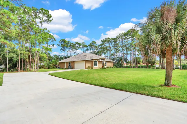 a view of an empty room with glass door