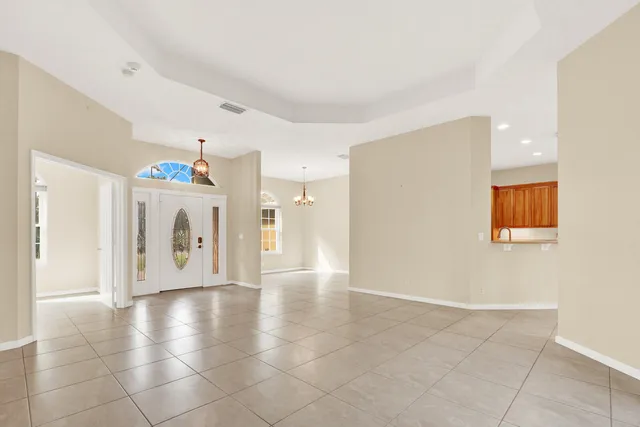 a large kitchen with stainless steel appliances kitchen island granite countertop a sink and cabinets