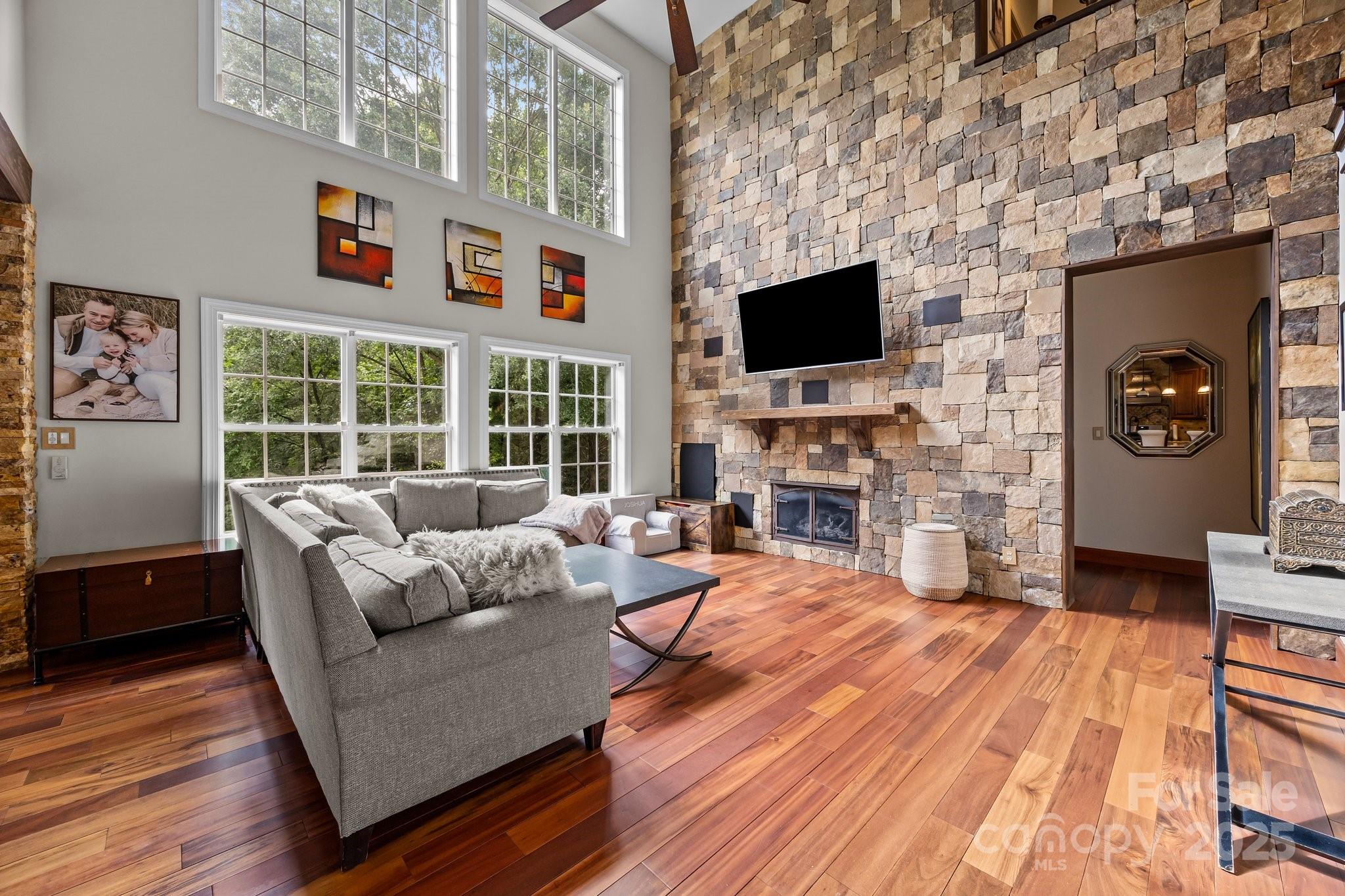 10919 Valley Spring Drive Charlotte, NC 28277 - Photo 15 of 47 a living room with fireplace furniture and a flat screen tv