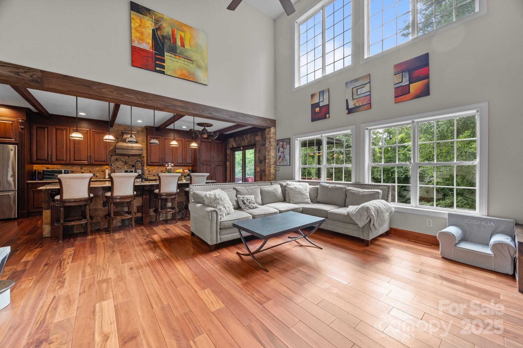 10919 Valley Spring Drive Charlotte, NC 28277 - Photo 16 of 47 a living room with furniture and a large window