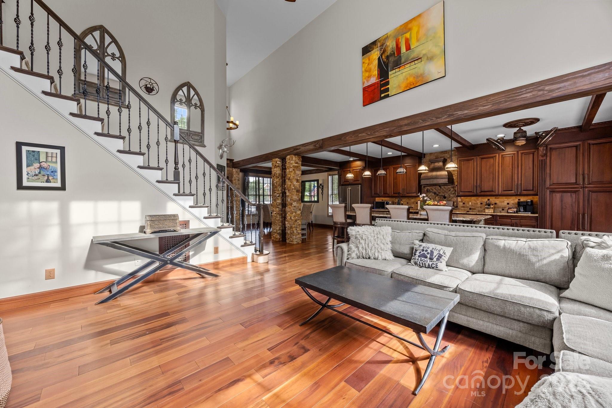 10919 Valley Spring Drive Charlotte, NC 28277 - Photo 17 of 47 a living room with furniture kitchen view and a table