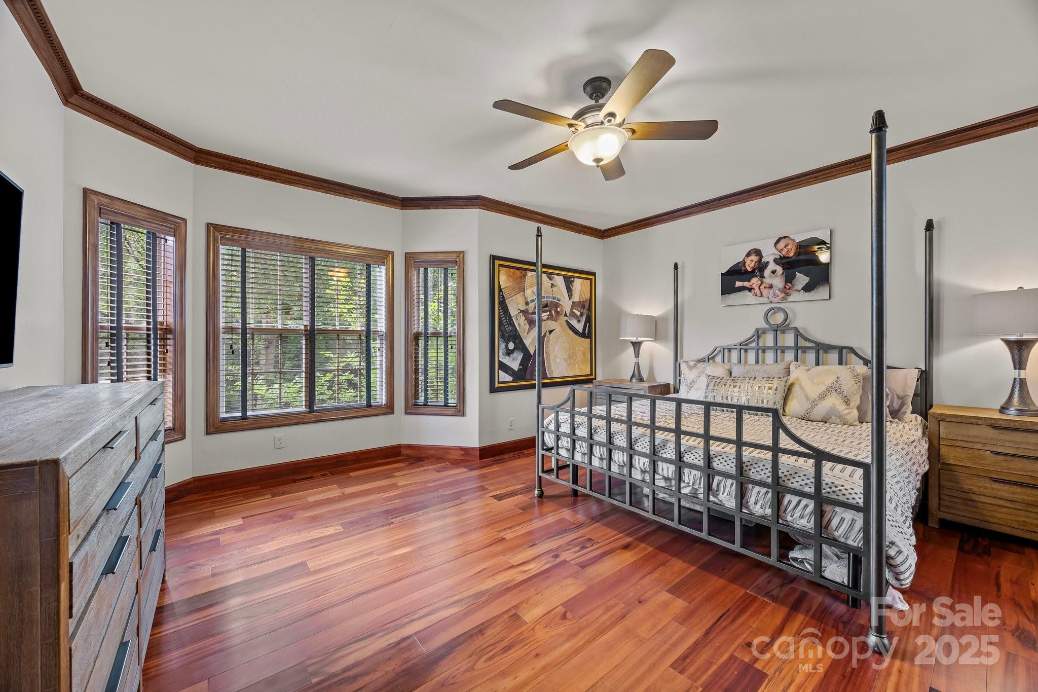 10919 Valley Spring Drive Charlotte, NC 28277 - Photo 18 of 47 a bedroom with furniture and wooden floor