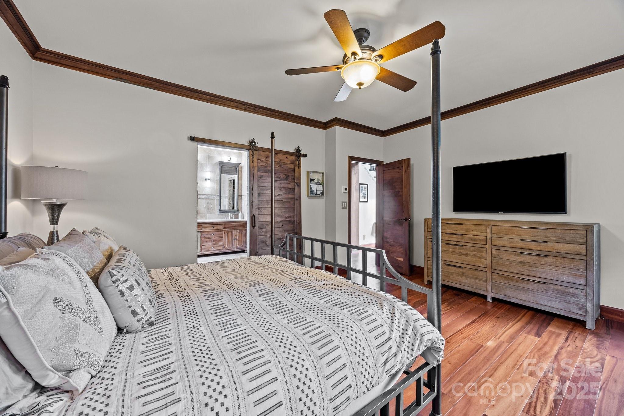 10919 Valley Spring Drive Charlotte, NC 28277 - Photo 20 of 47 a bedroom with a bed and a flat screen tv