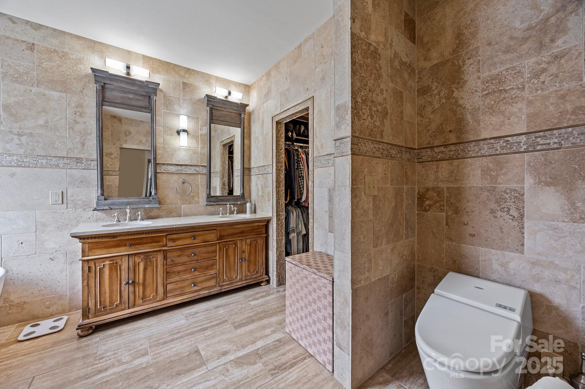 10919 Valley Spring Drive Charlotte, NC 28277 - Photo 21 of 47 a spacious bathroom with a granite countertop sink toilet and shower