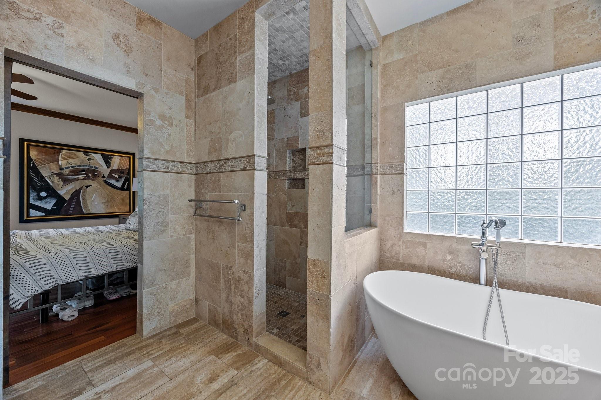 10919 Valley Spring Drive Charlotte, NC 28277 - Photo 22 of 47 a bathroom with a tub a sink and a shower