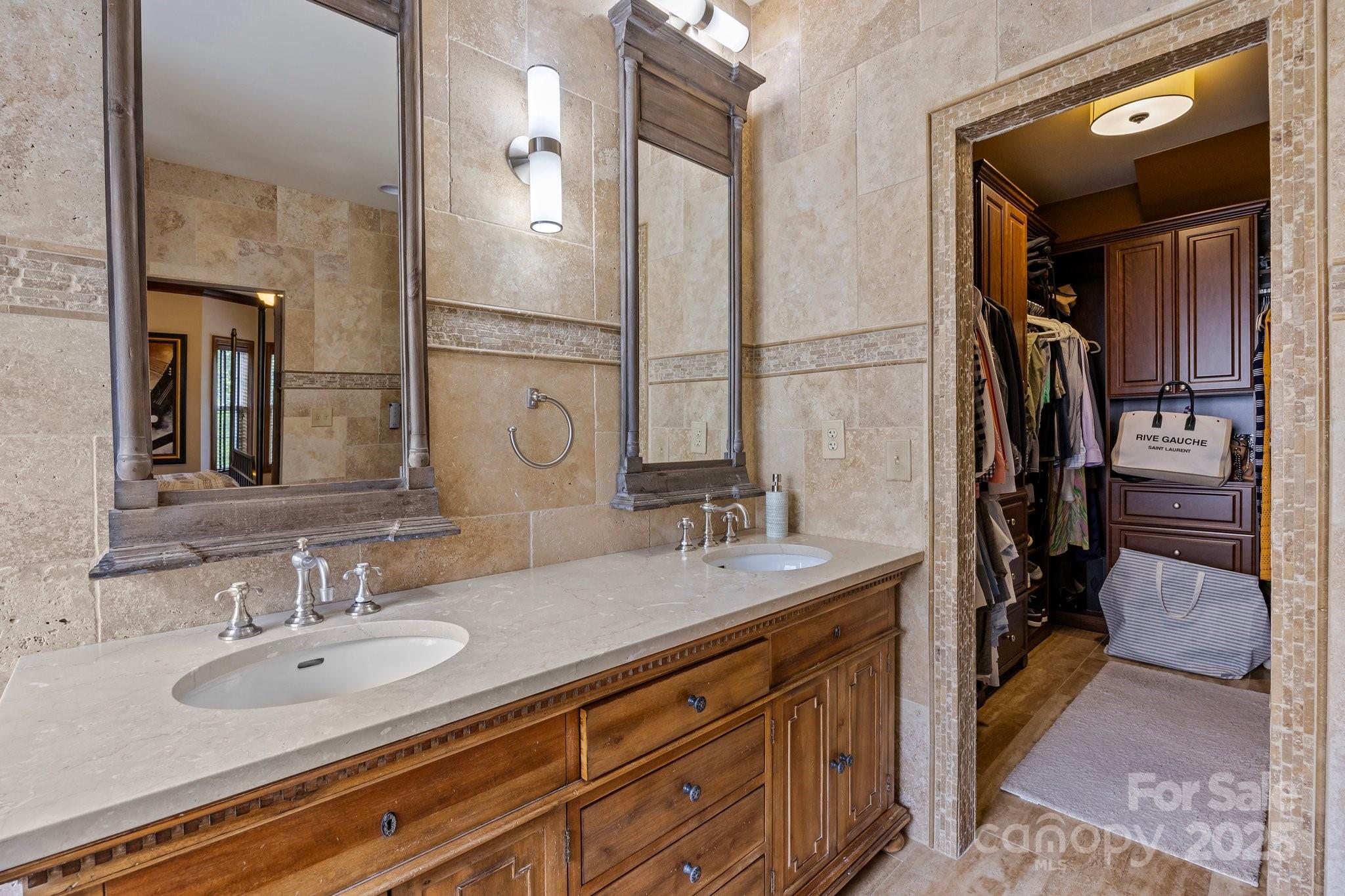 10919 Valley Spring Drive Charlotte, NC 28277 - Photo 23 of 47 a bathroom with a sink double vanity