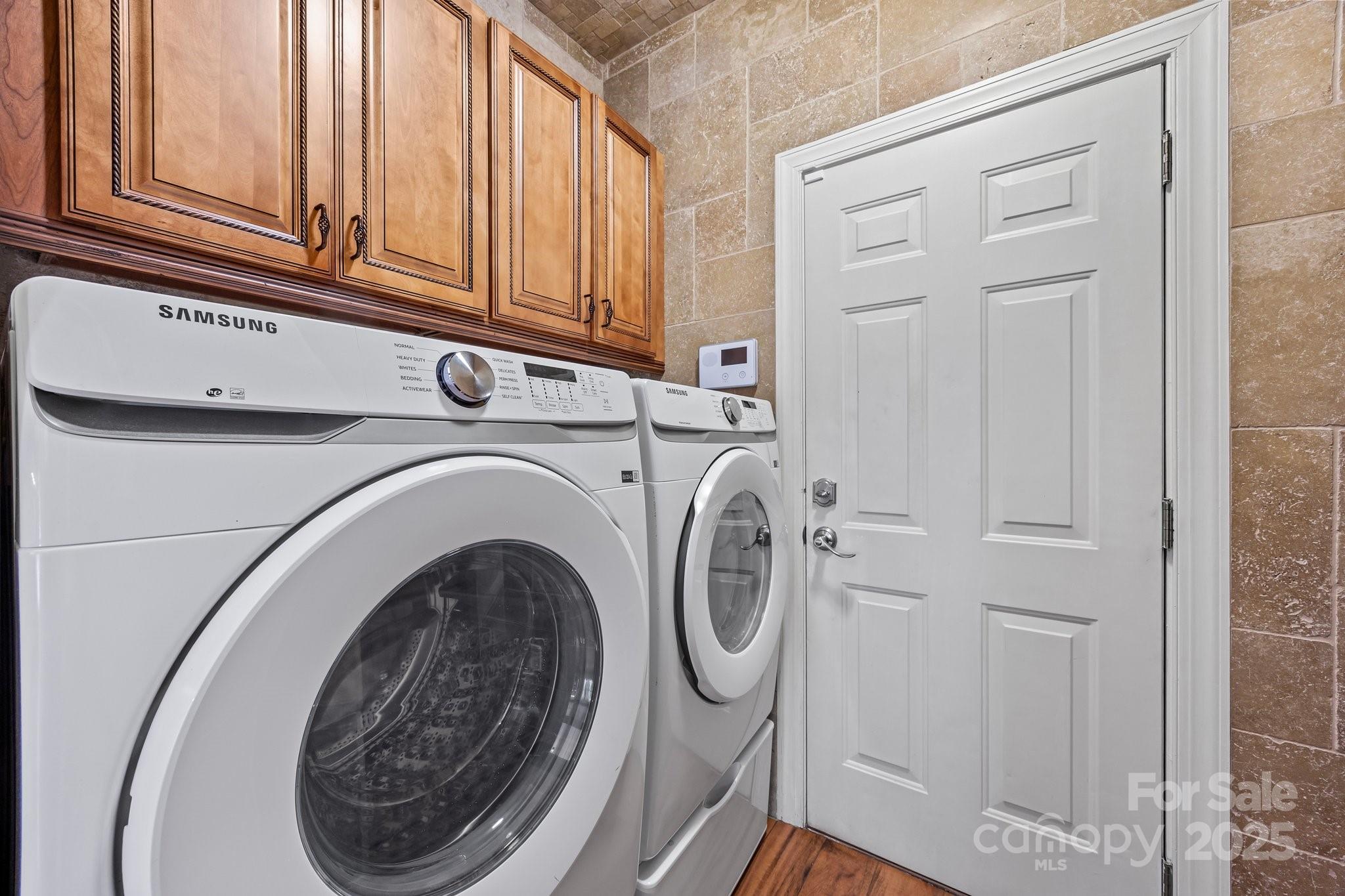 10919 Valley Spring Drive Charlotte, NC 28277 - Photo 26 of 47 a utility room with dryer and washer