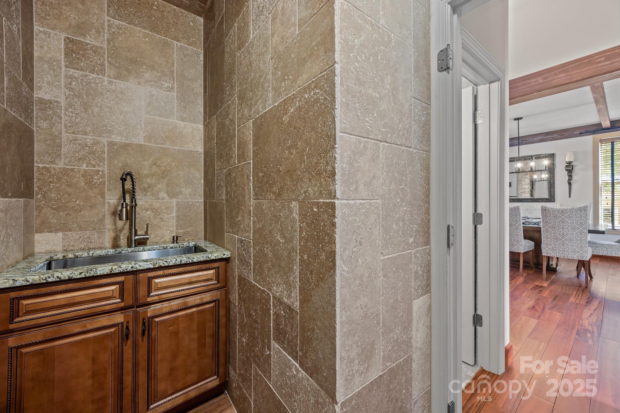 10919 Valley Spring Drive Charlotte, NC 28277 - Photo 27 of 47 a bathroom with a granite countertop shower a sink and a mirror