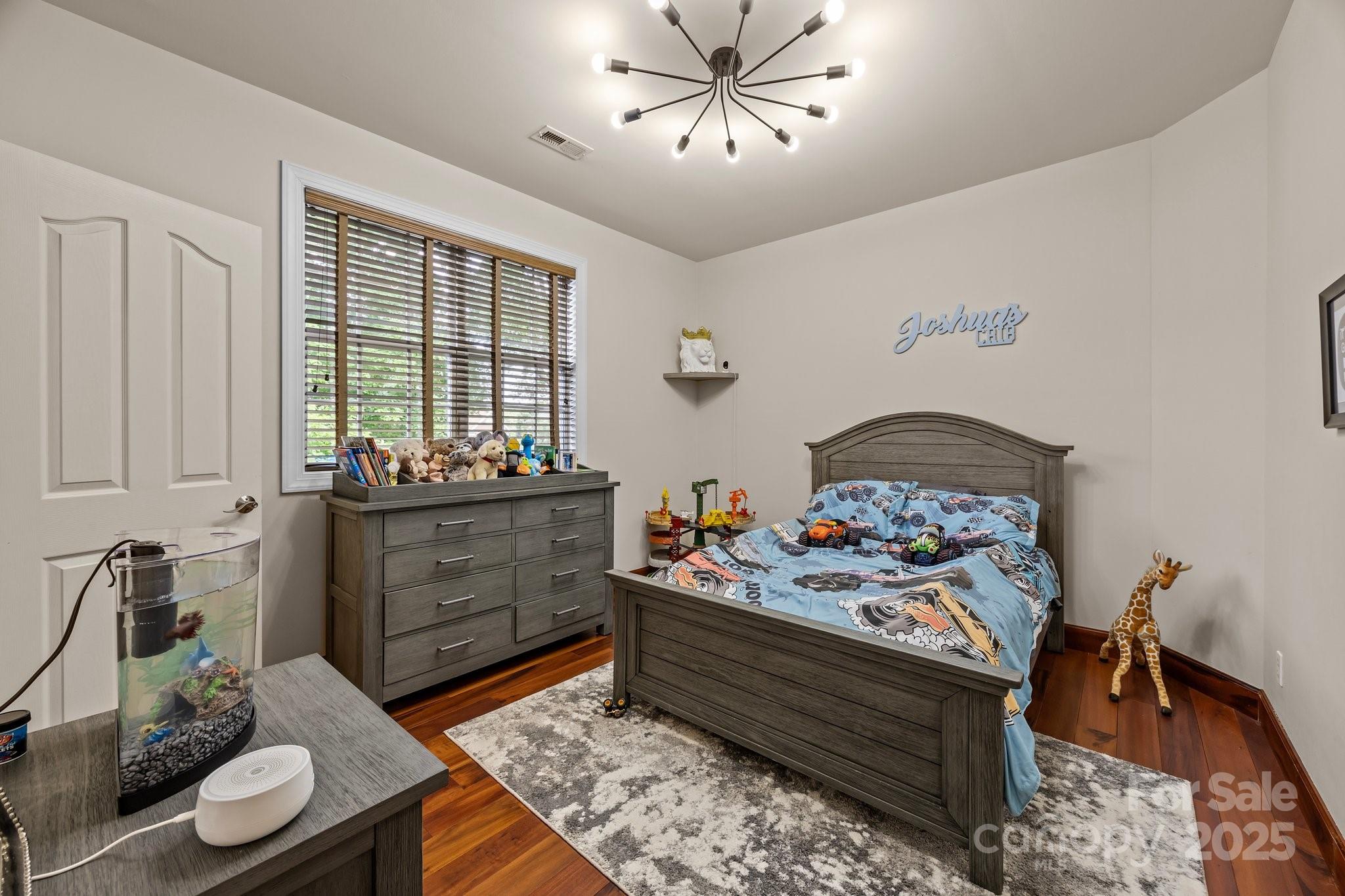 10919 Valley Spring Drive Charlotte, NC 28277 - Photo 28 of 47 a bed room with furniture and a window