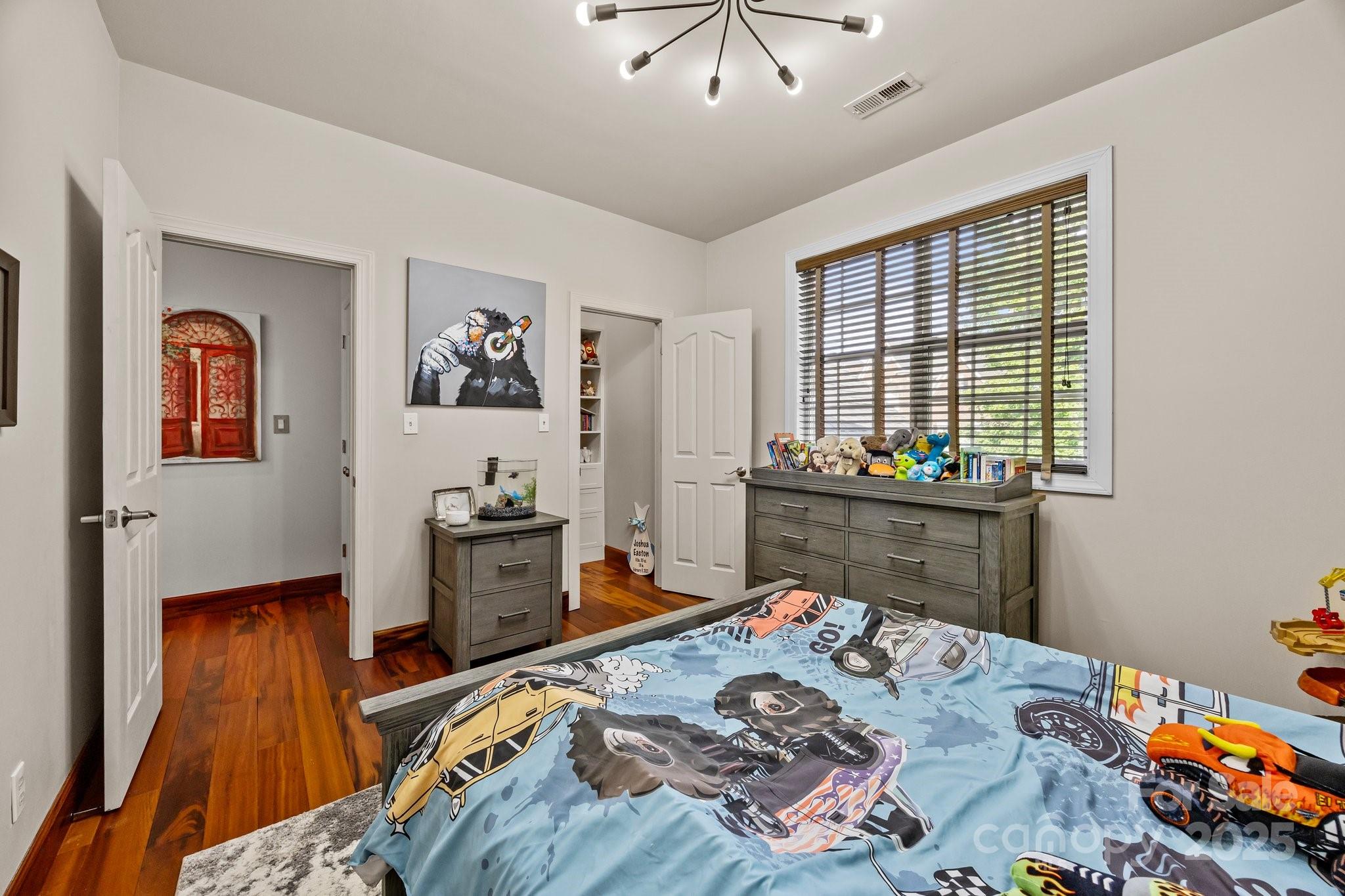 10919 Valley Spring Drive Charlotte, NC 28277 - Photo 29 of 47 a bed in a bedroom next to a window