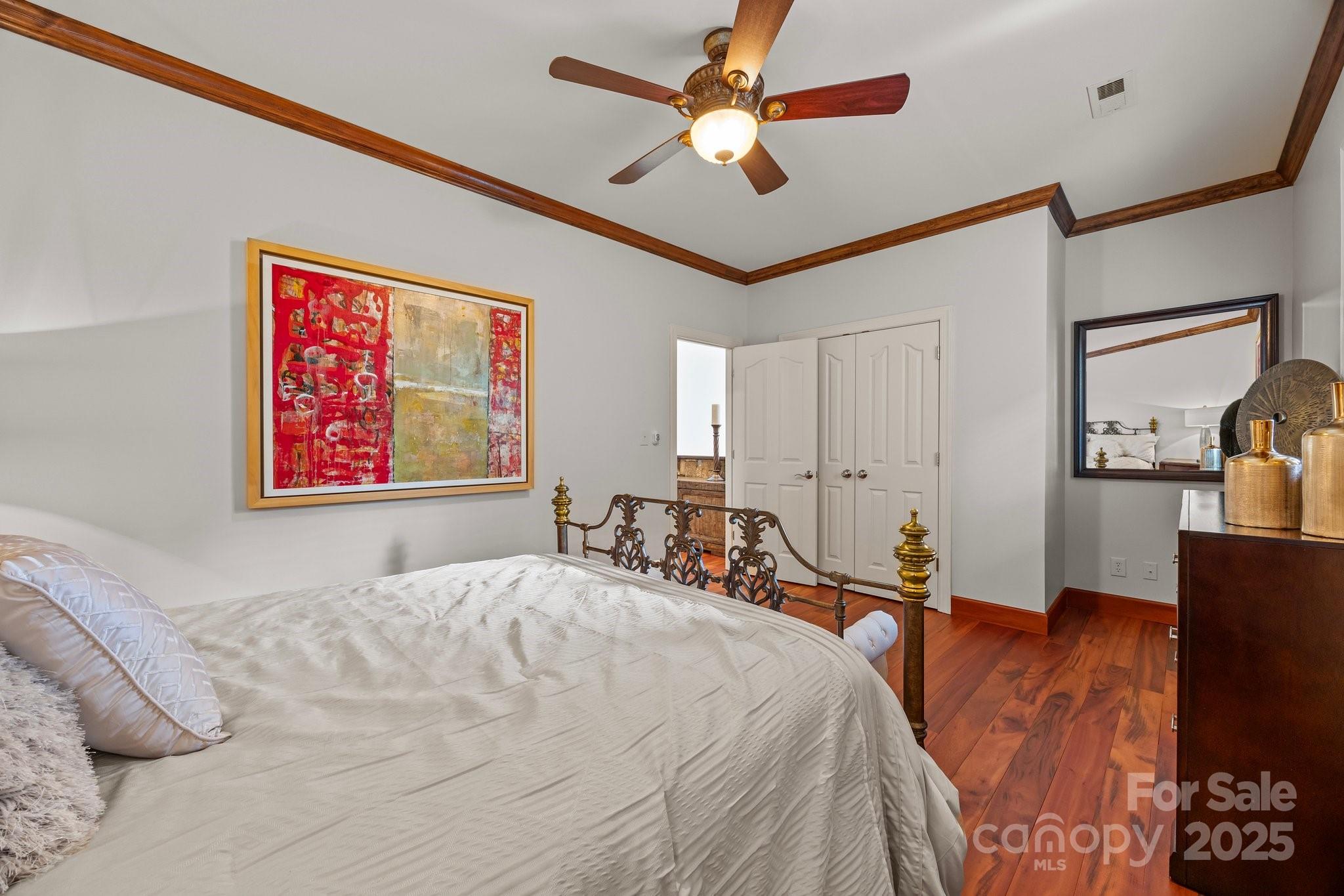 10919 Valley Spring Drive Charlotte, NC 28277 - Photo 33 of 47 a bed room with a bed and a painting on the wall