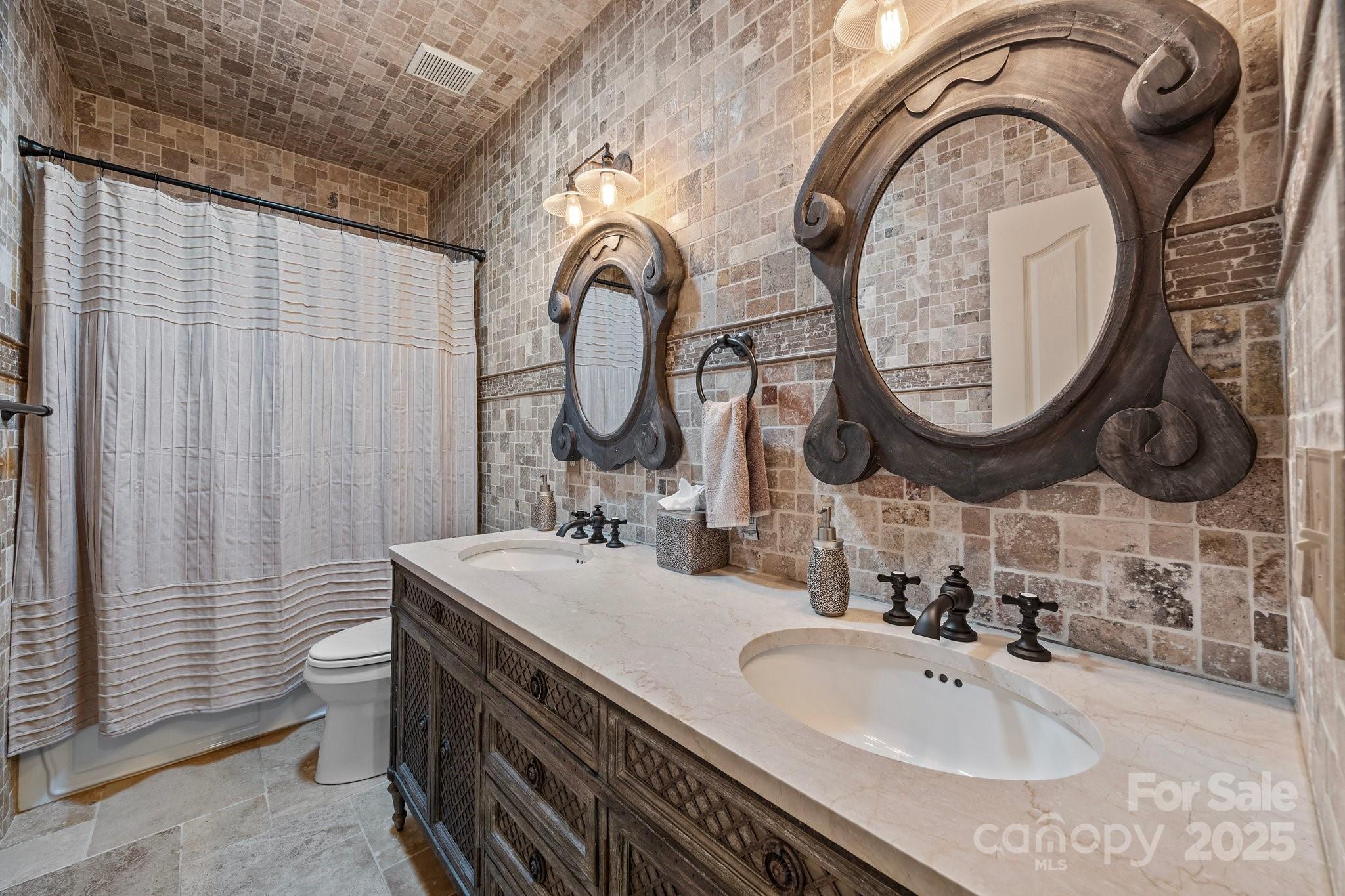 10919 Valley Spring Drive Charlotte, NC 28277 - Photo 34 of 47 a bathroom with a sink and a mirror
