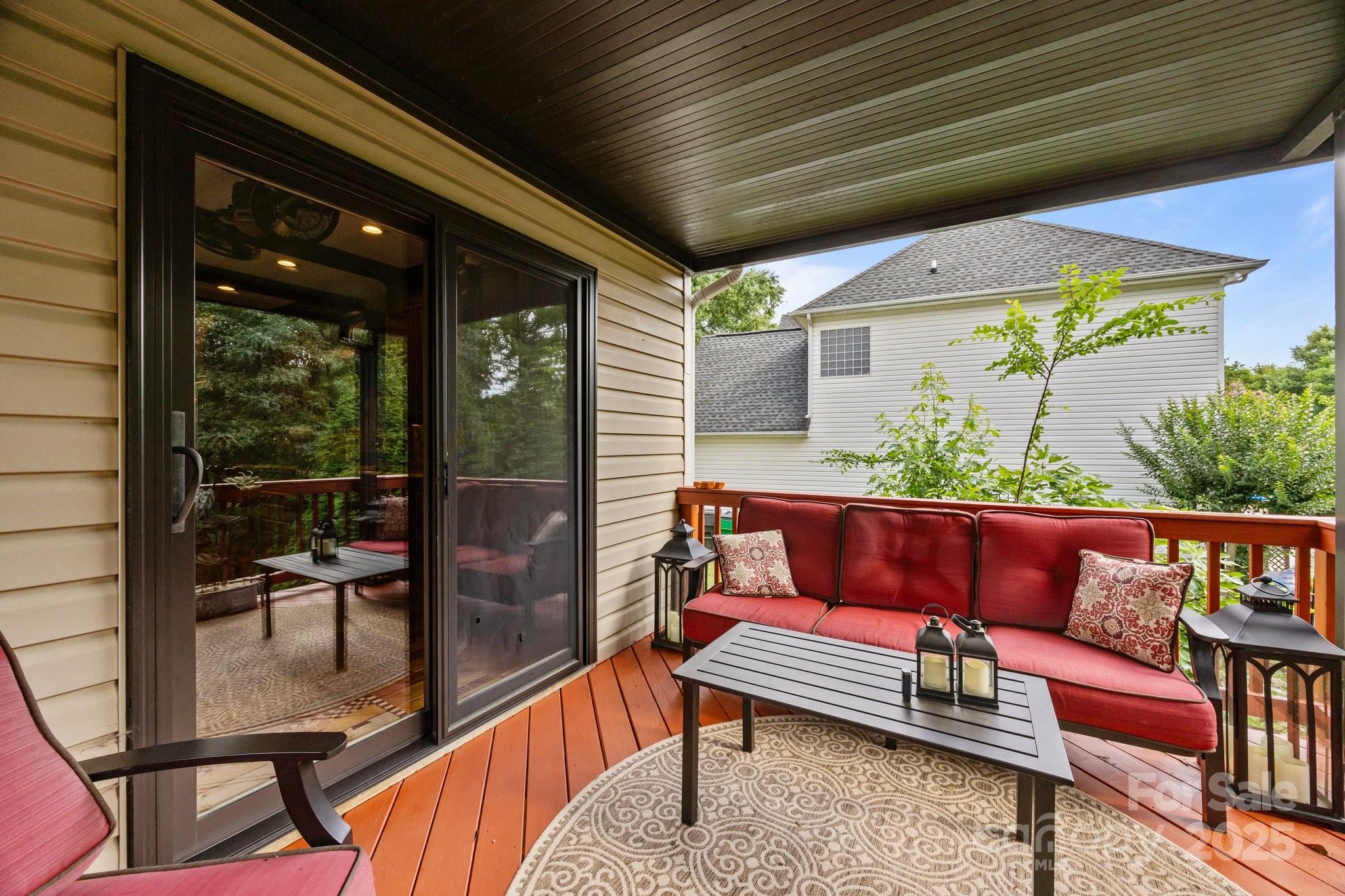 10919 Valley Spring Drive Charlotte, NC 28277 - Photo 35 of 47 a roof deck with a table and chairs