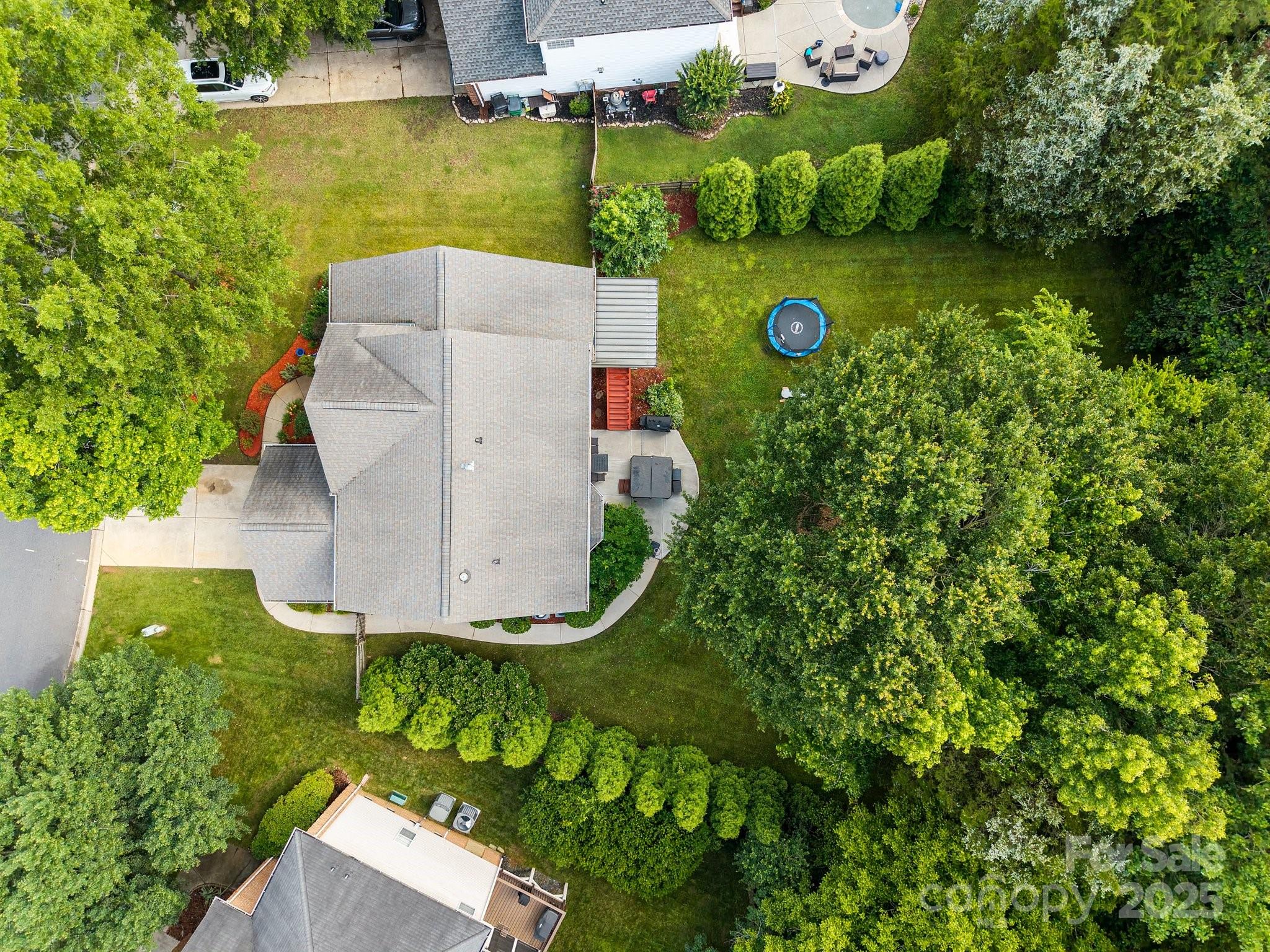 10919 Valley Spring Drive Charlotte, NC 28277 - Photo 43 of 47 an aerial view of a house with garden space and street view