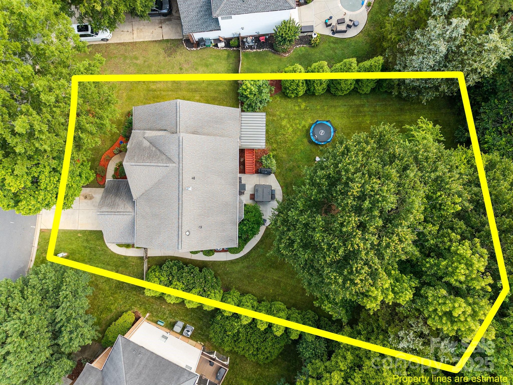 10919 Valley Spring Drive Charlotte, NC 28277 - Photo 44 of 47 a view of swimming pool with a patio and a yard